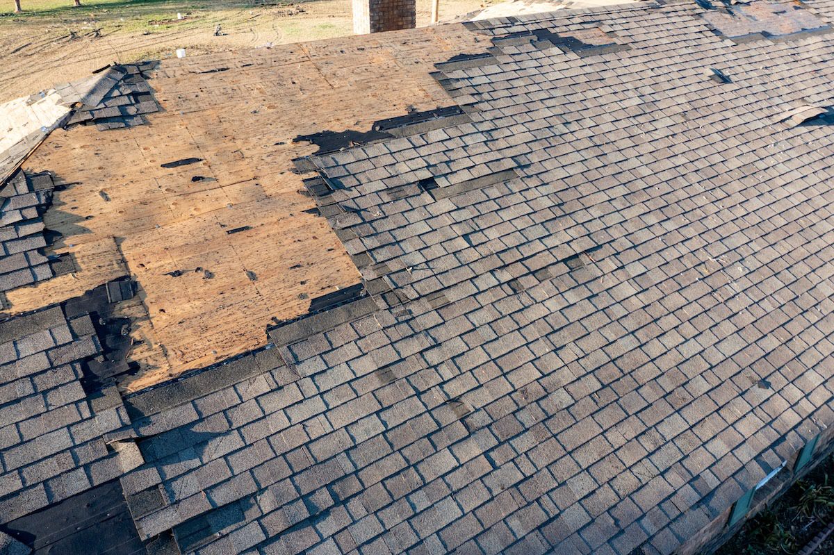 Tornado damage to roof and shingles.