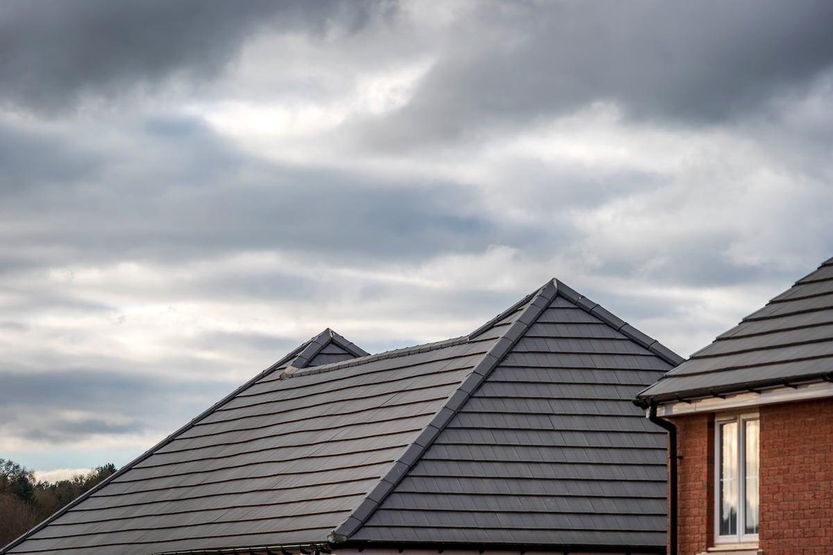 new built houses over cloudy sky in england uk..