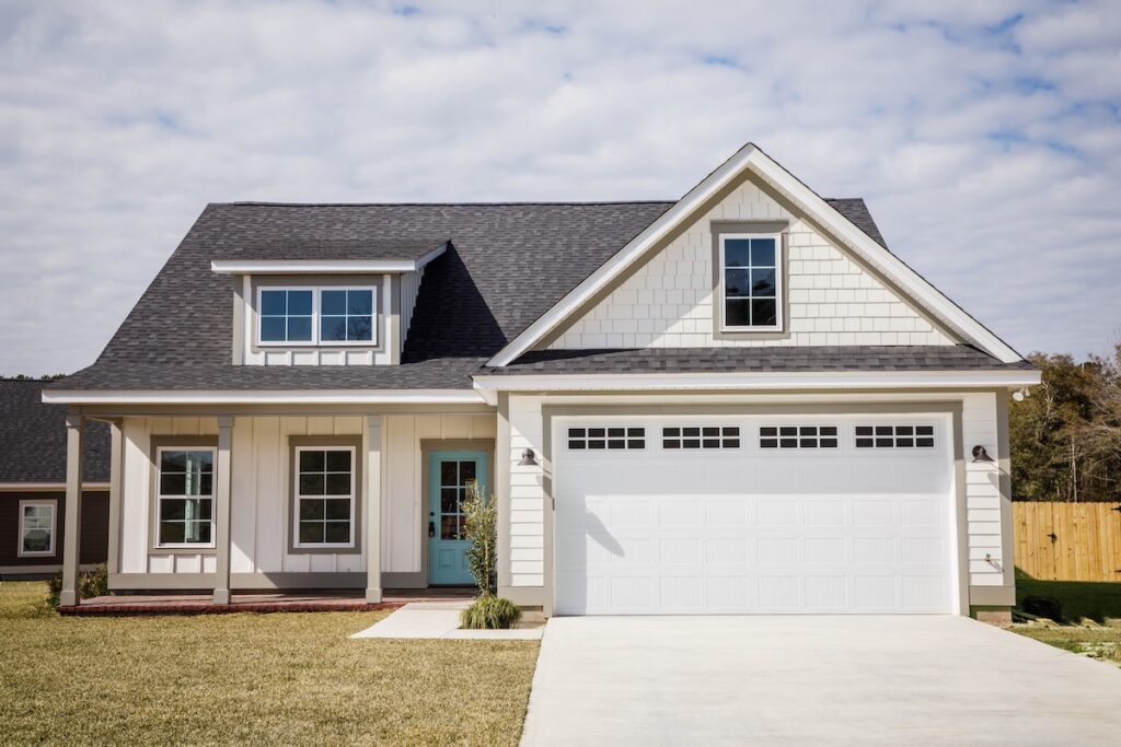 Modern new Construction White Siding Cottage House for Sale in Suburbs with Turquoise Door