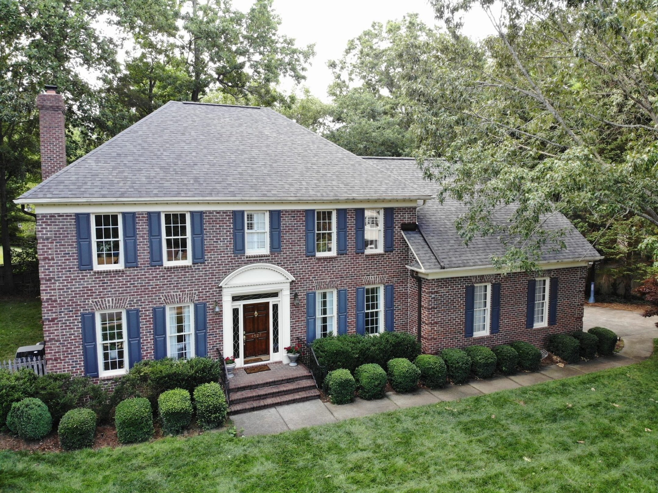 new asphalt roofing blue window shutters romans
