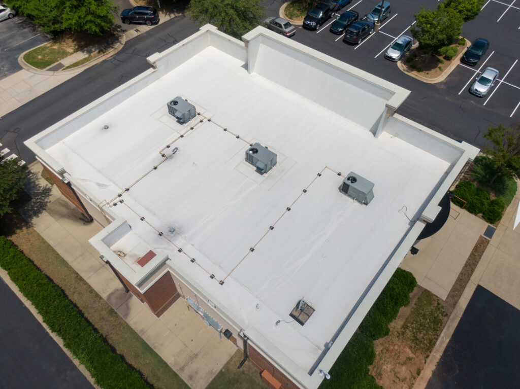 commercial roof warranty Drone Images of Commercial Roofs Featuring TPO and Asphalt Shingles: Midday, Sunny, No People
