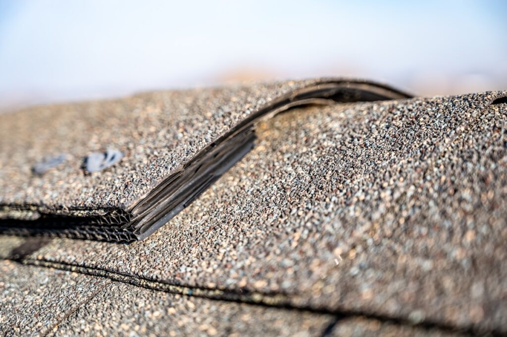 Typical residentail ridge cap on a shingle roof apex
