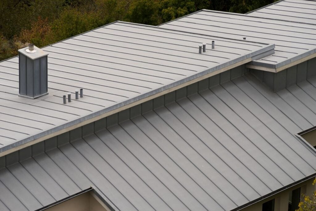 bright grey metal roof insulation huge building autumn beige walls
