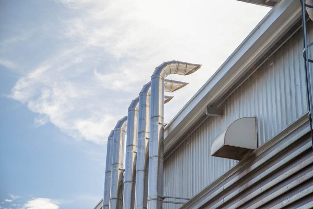 light grey metal roof scupper big business commercial building