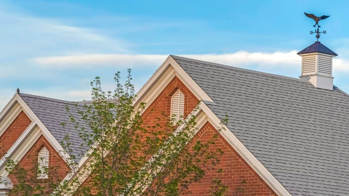 hip roof vs gable roof grey roof brick walls vent on top