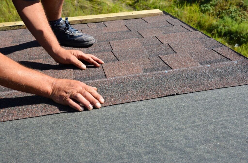 how to install architectural shingles worker installing brown roof