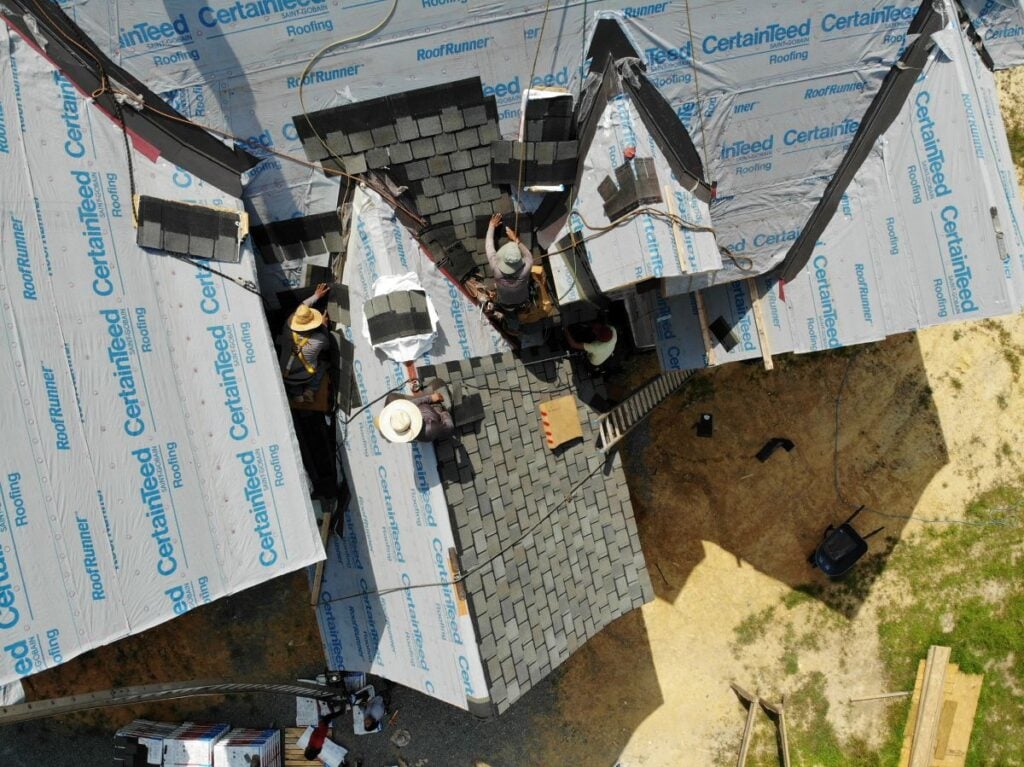 missing shingles Great State Roofing workers replacing big damaged roof after storm