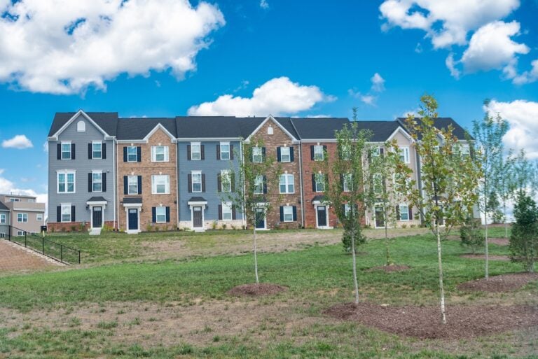 Multi-family homes in a large community. Modern bricks townhouse