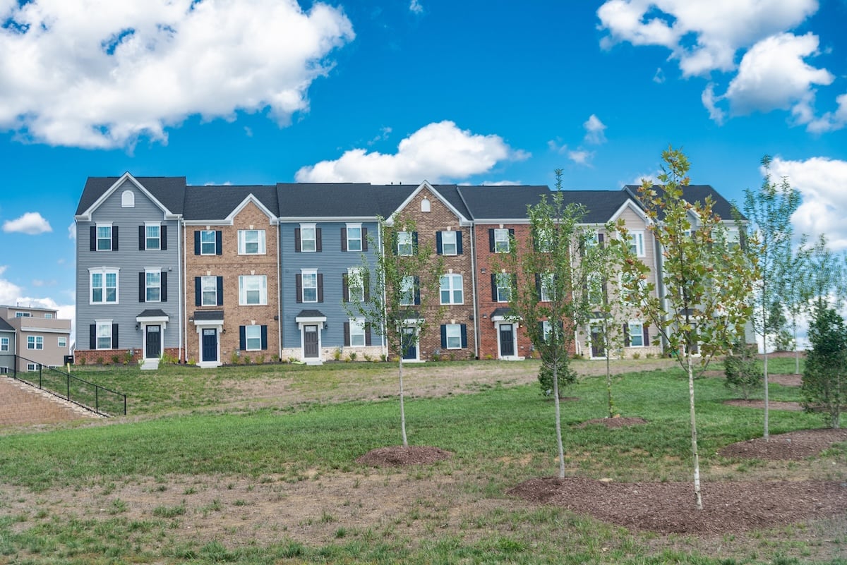 Multi-family homes in a large community. Modern bricks townhouse