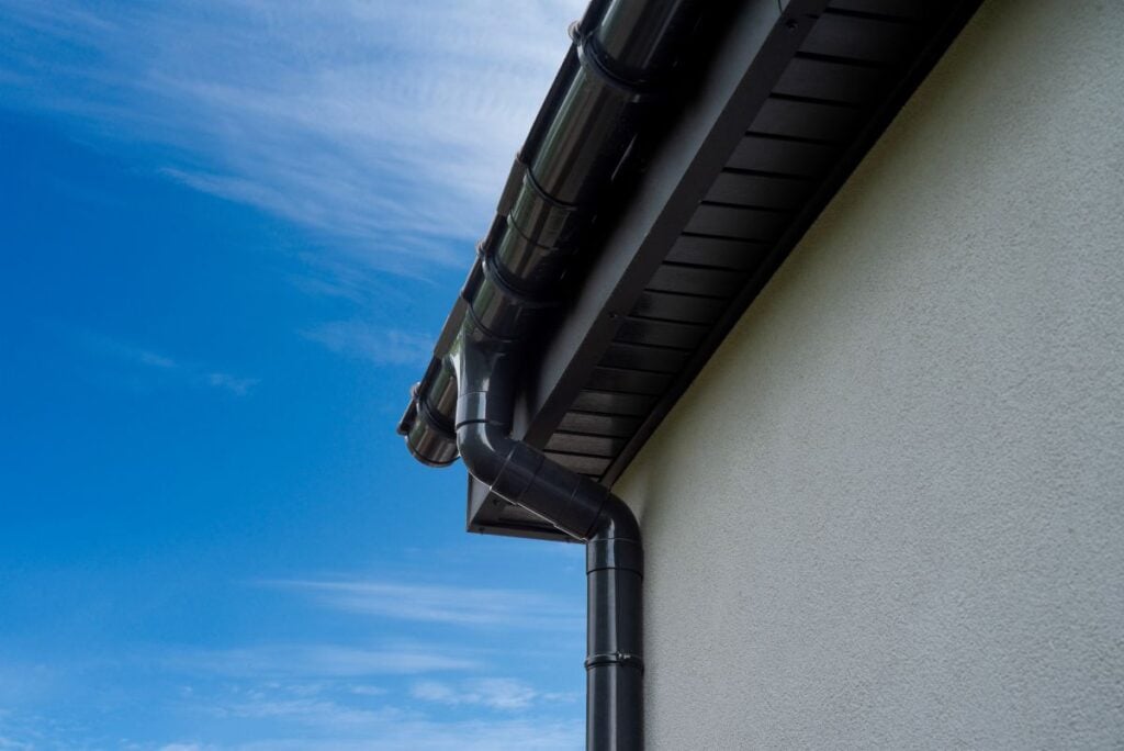 what is fascia on a house black plastic fascia with water drain white wall
