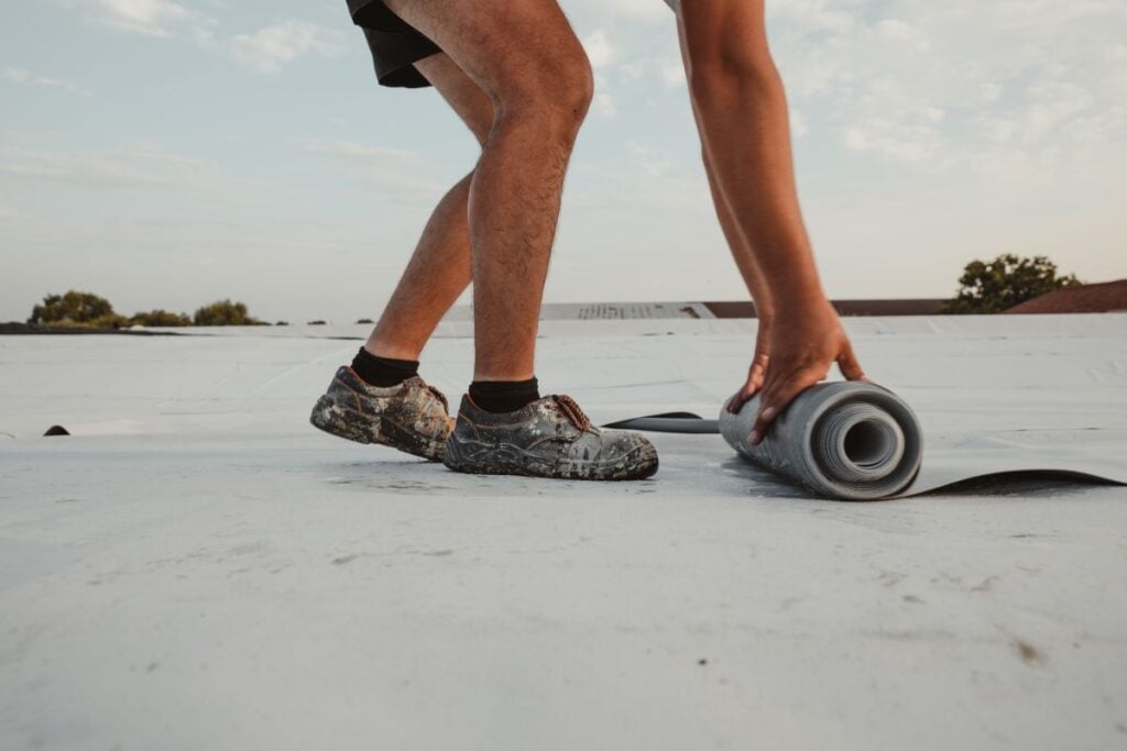 roofer installing TPO on a commercial roof