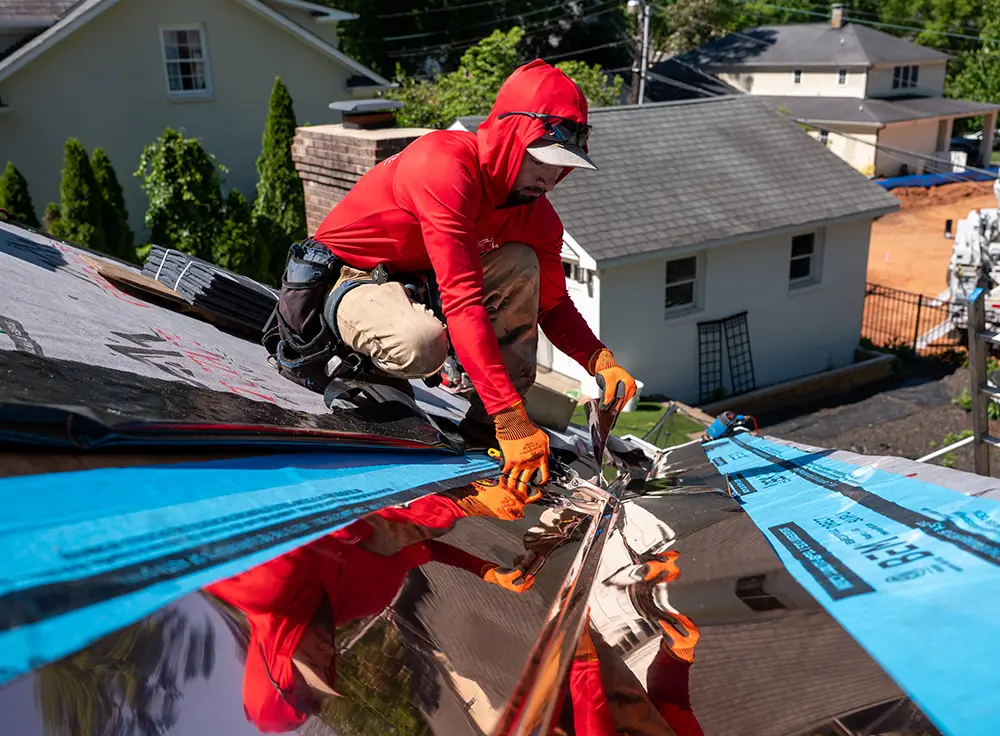 Custom copper flashing with synthetic slate roofing