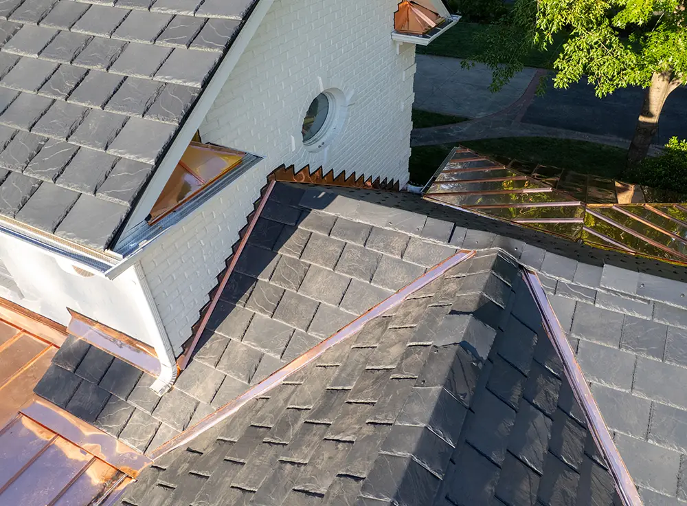 Completed synthetic slate and copper roof replacement in Charlotte