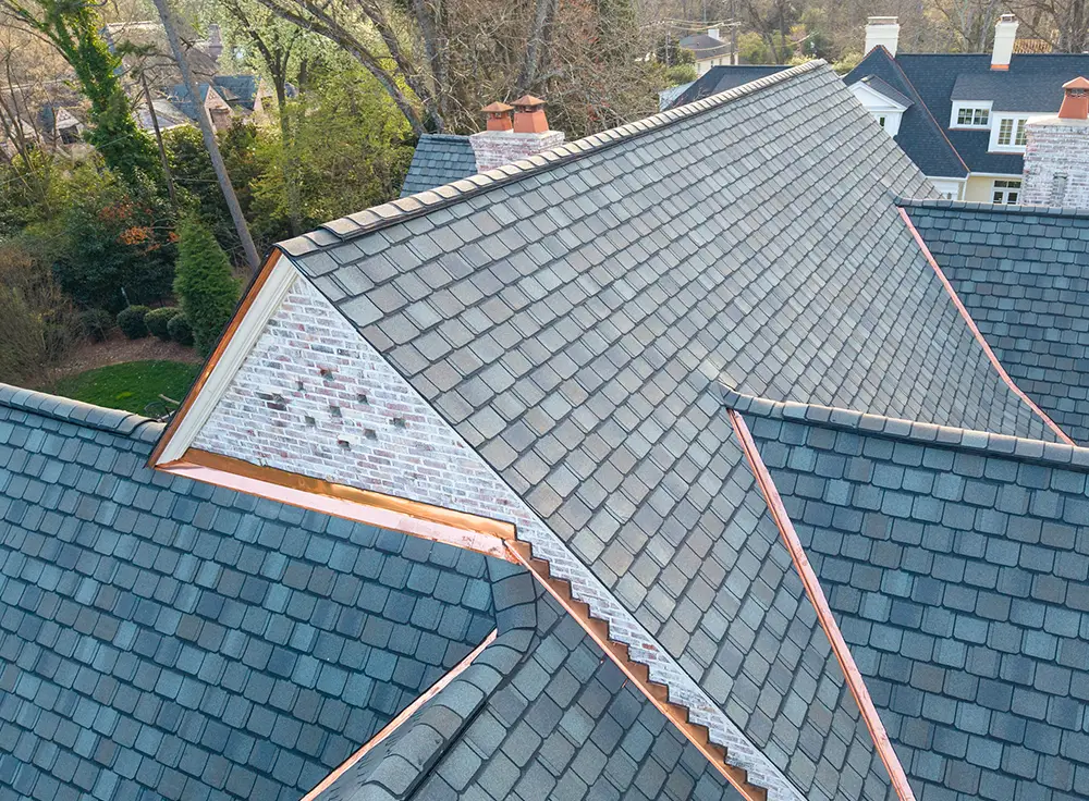 Custom copper valley installation by Great State Roofing