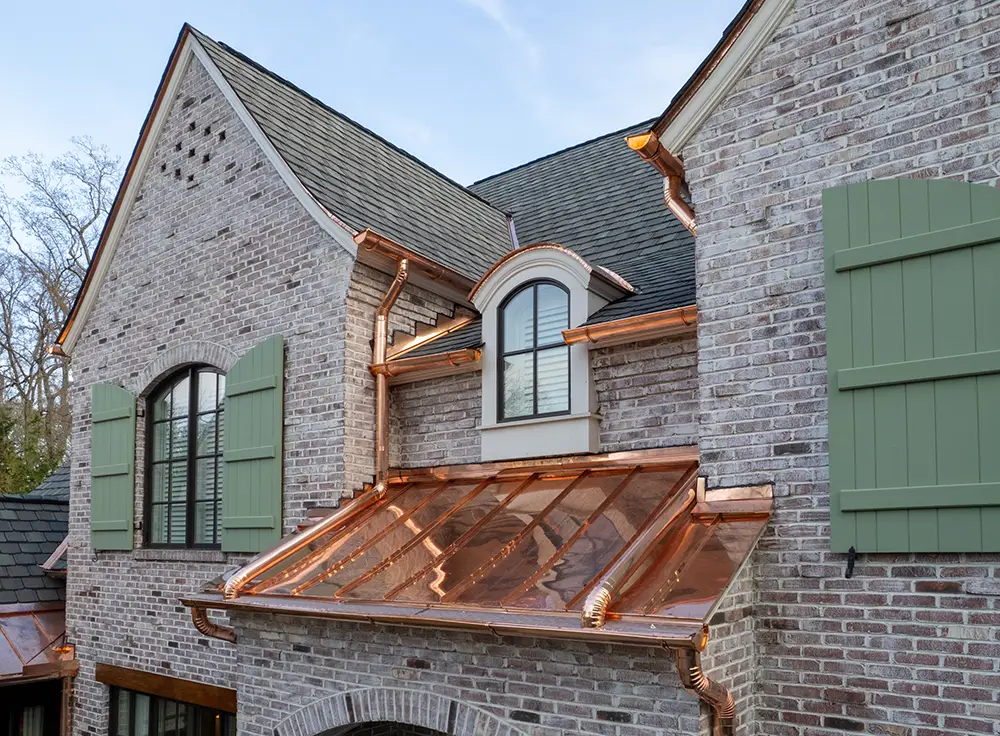 Half-round copper gutters and downspouts in Greensboro