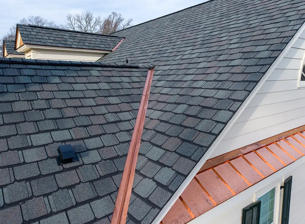Custom copper valleys installed on Greensboro luxury home