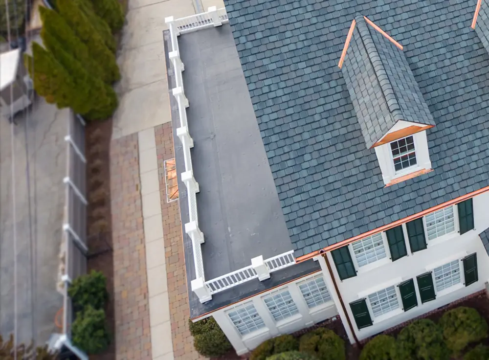 Custom copper flashing and Grand Manor shingle installation
