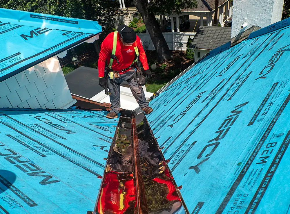 Custom copper flashing on specialty roof replacement