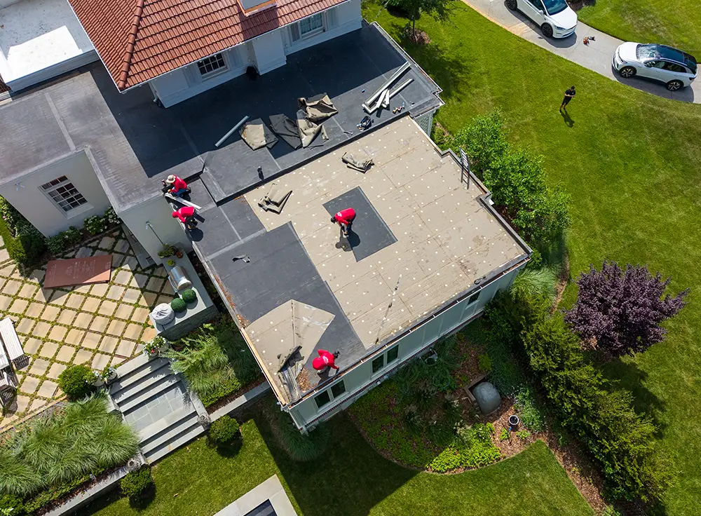 Fully adhered EPDM roofing on low-slope roof section