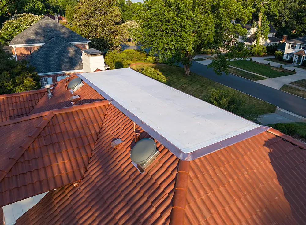 TPO membrane roofing with custom coping caps and edge metal